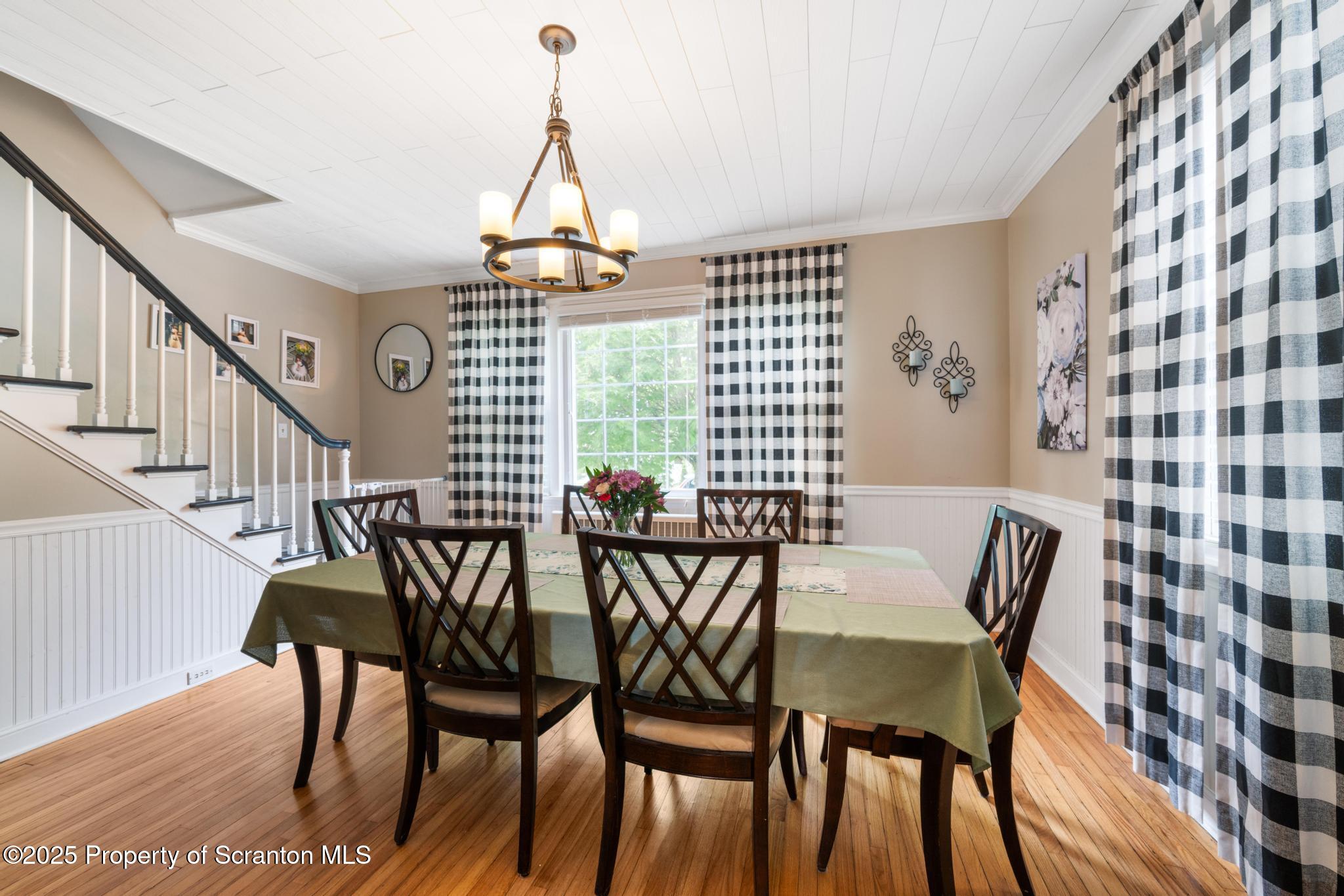 114 Spring Street Clarks Green, PA 18411 - Photo 19 of 47 a view of a dining room with furniture and wooden floor