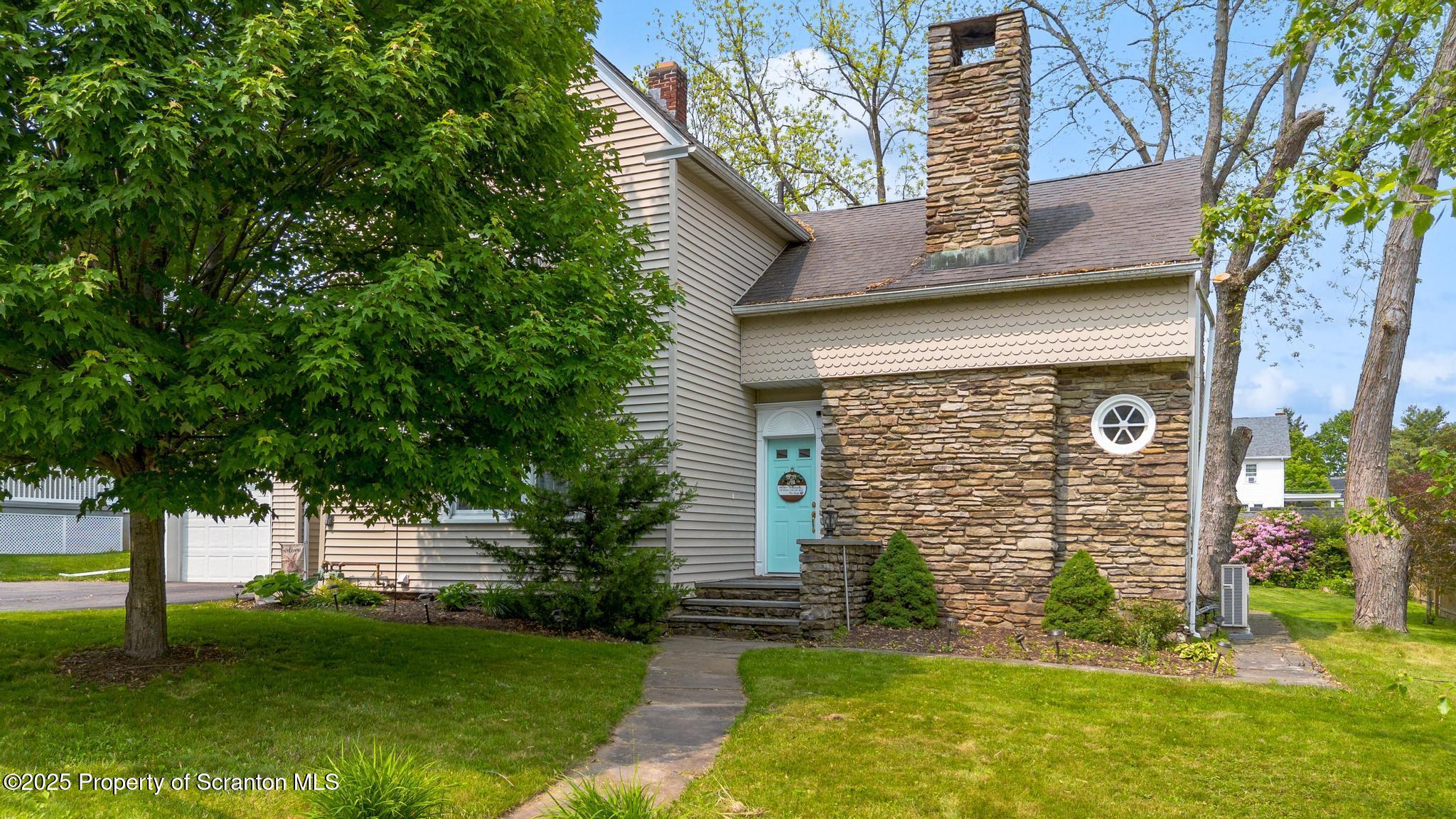 114 Spring Street Clarks Green, PA 18411 - Photo 2 of 47 a front view of a house with a yard