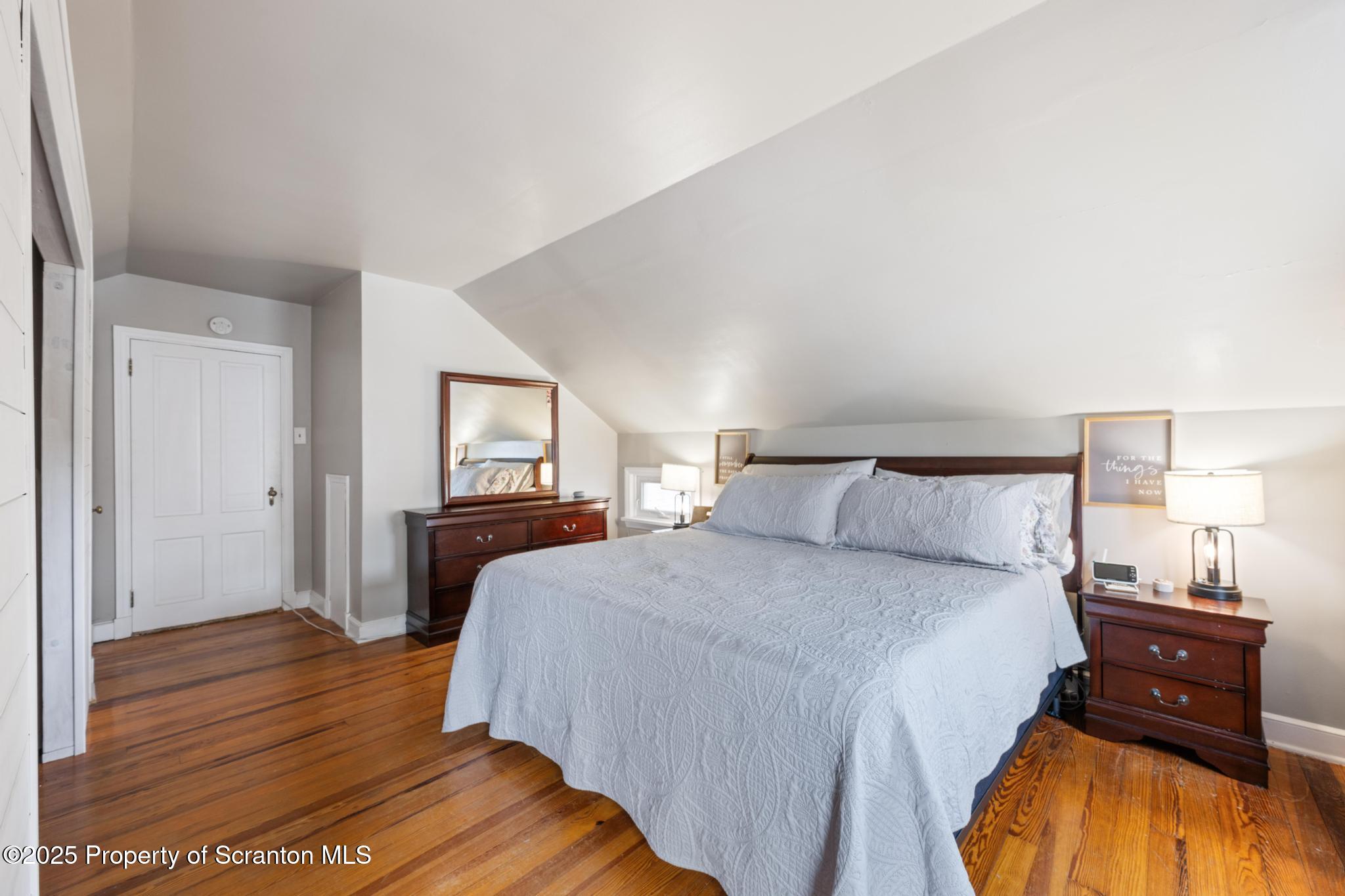 114 Spring Street Clarks Green, PA 18411 - Photo 23 of 47 a bedroom with a bed and wooden floor