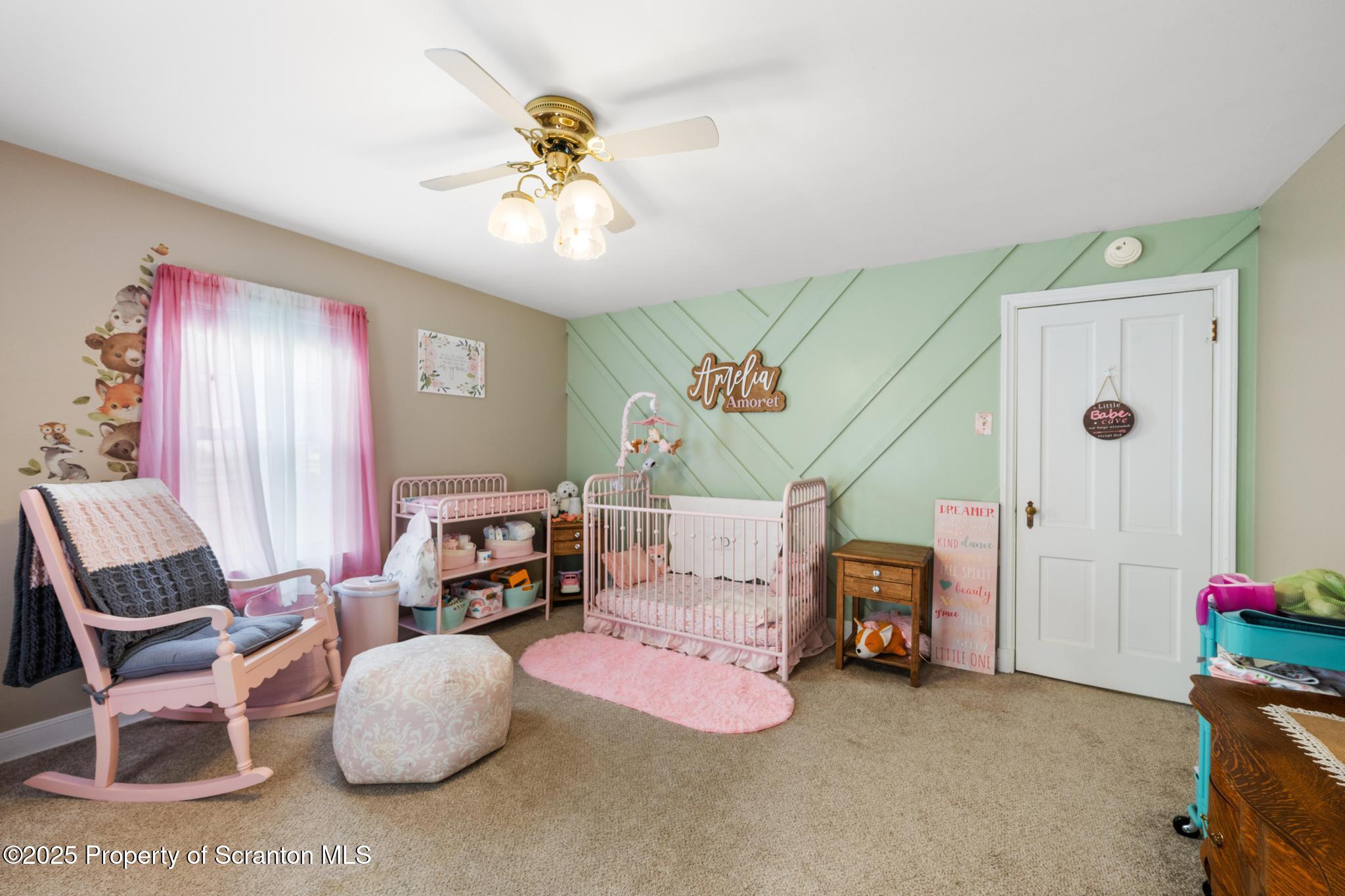 114 Spring Street Clarks Green, PA 18411 - Photo 28 of 47 a living room with furniture and a chandelier