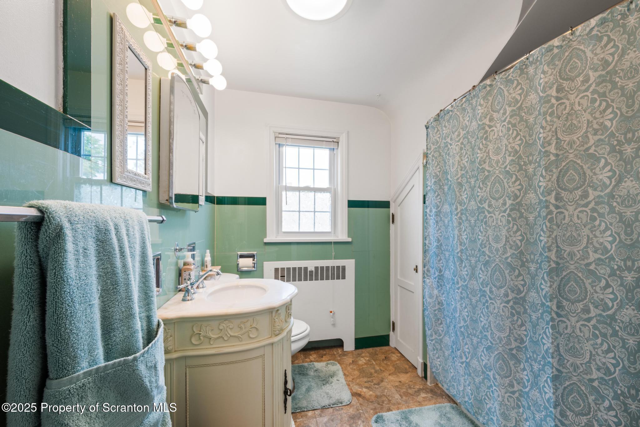 114 Spring Street Clarks Green, PA 18411 - Photo 30 of 47 a bathroom with a sink a toilet and shower