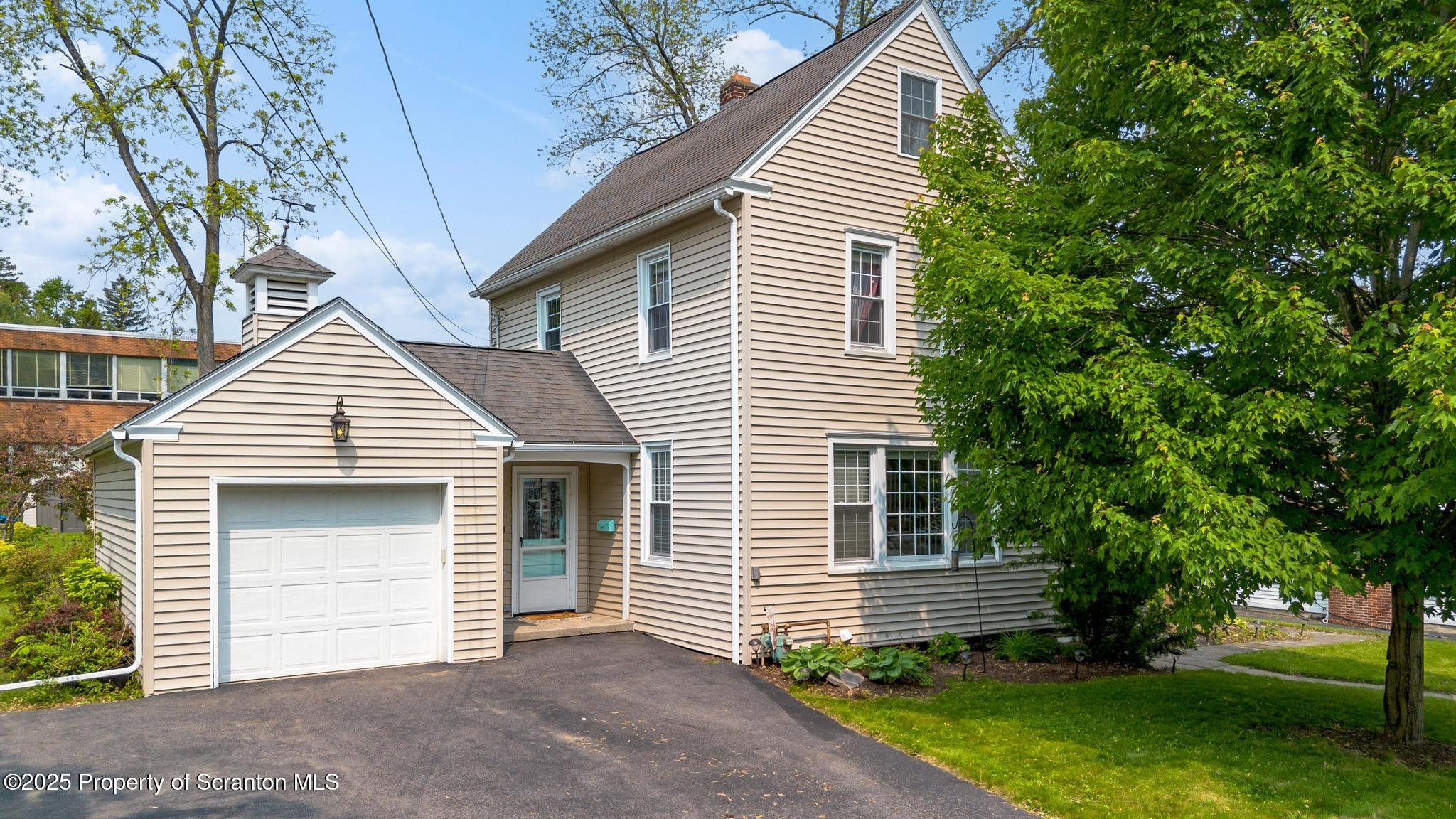 114 Spring Street Clarks Green, PA 18411 - Photo 3 of 47 a front view of a house with a garden