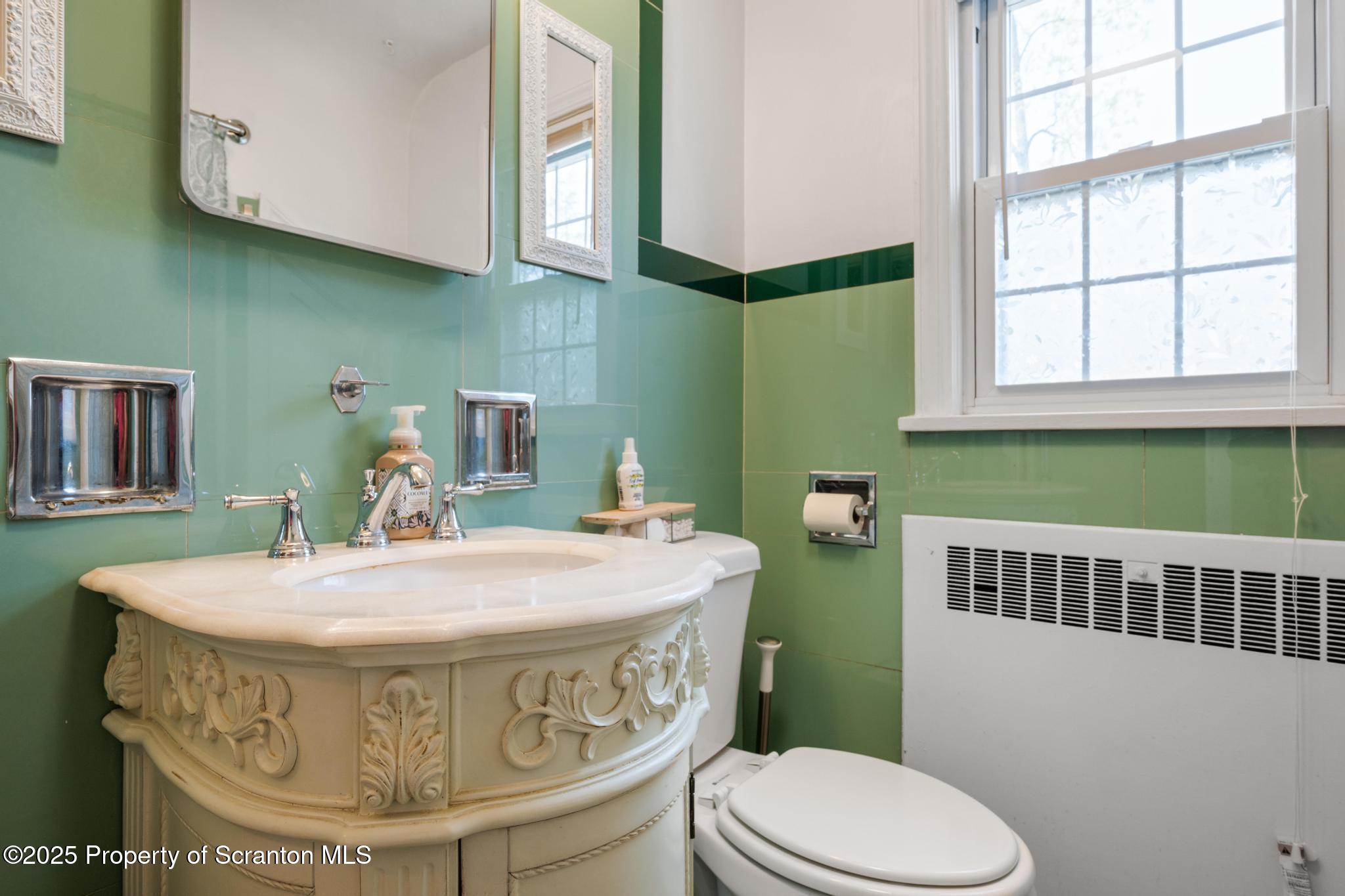 114 Spring Street Clarks Green, PA 18411 - Photo 31 of 47 a view of a bathroom with sink and a mirror