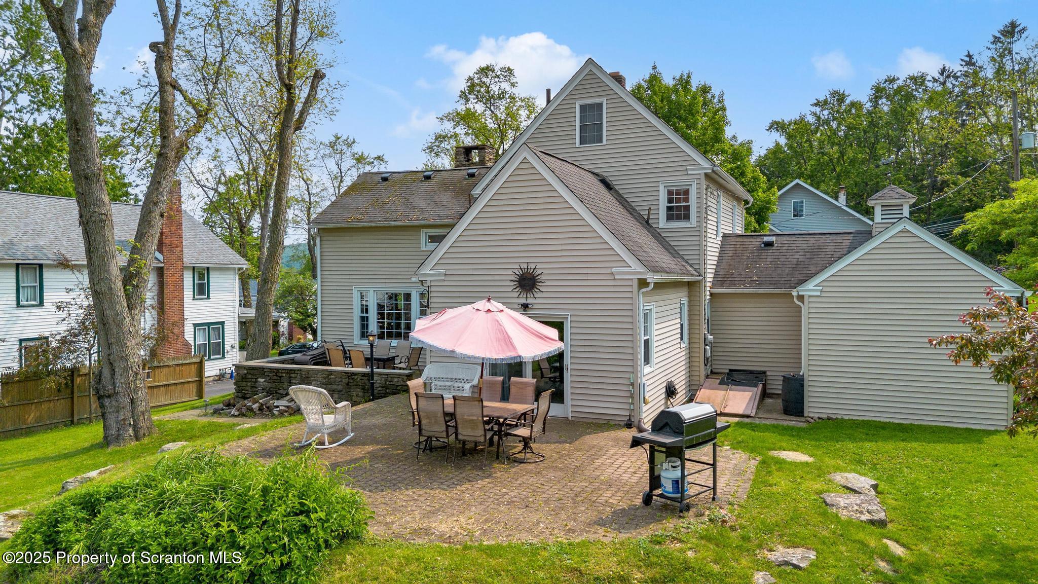 114 Spring Street Clarks Green, PA 18411 - Photo 39 of 47 a front view of a house with a garden and patio