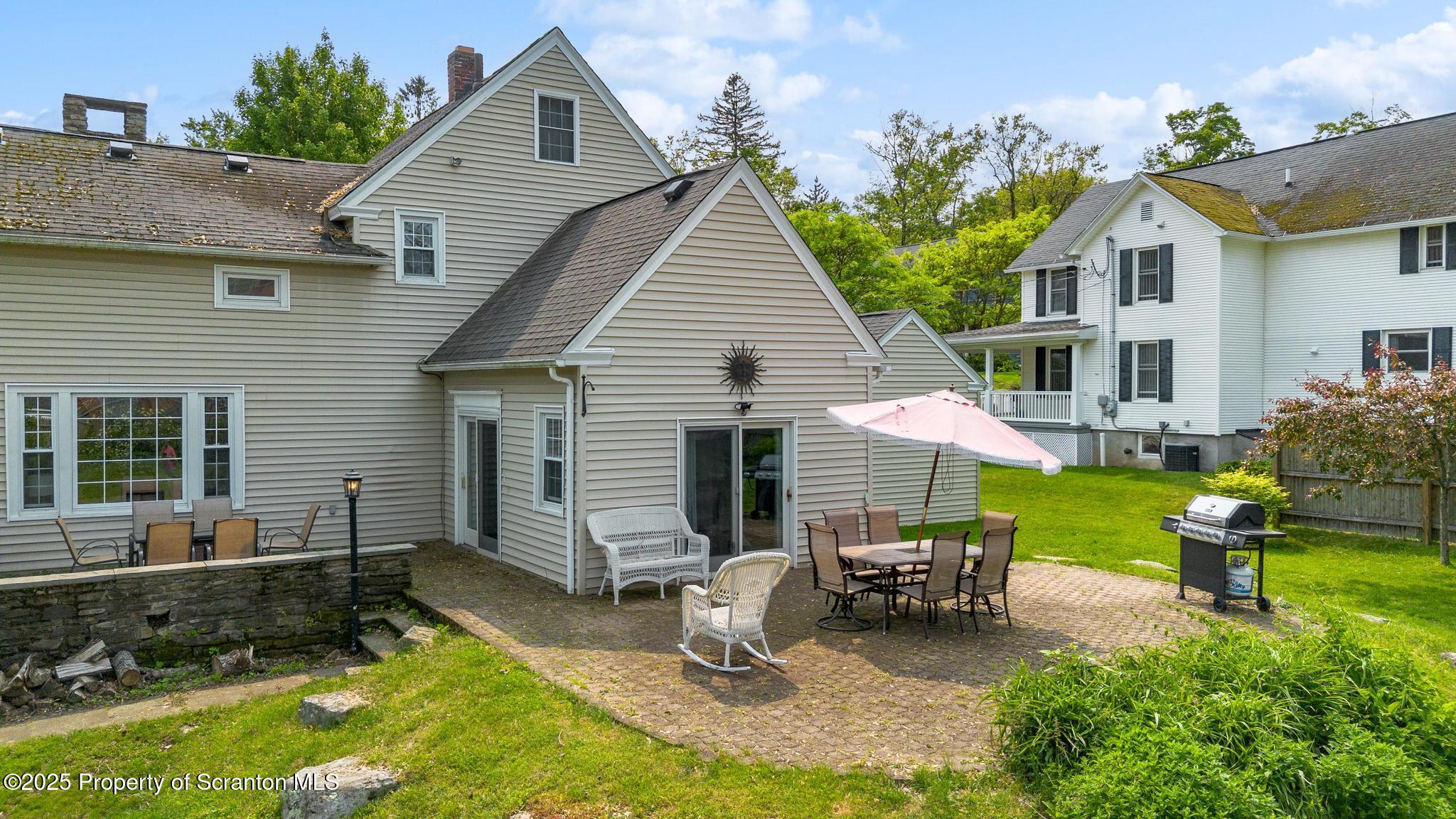 114 Spring Street Clarks Green, PA 18411 - Photo 40 of 47 a house view with a seating space and garden