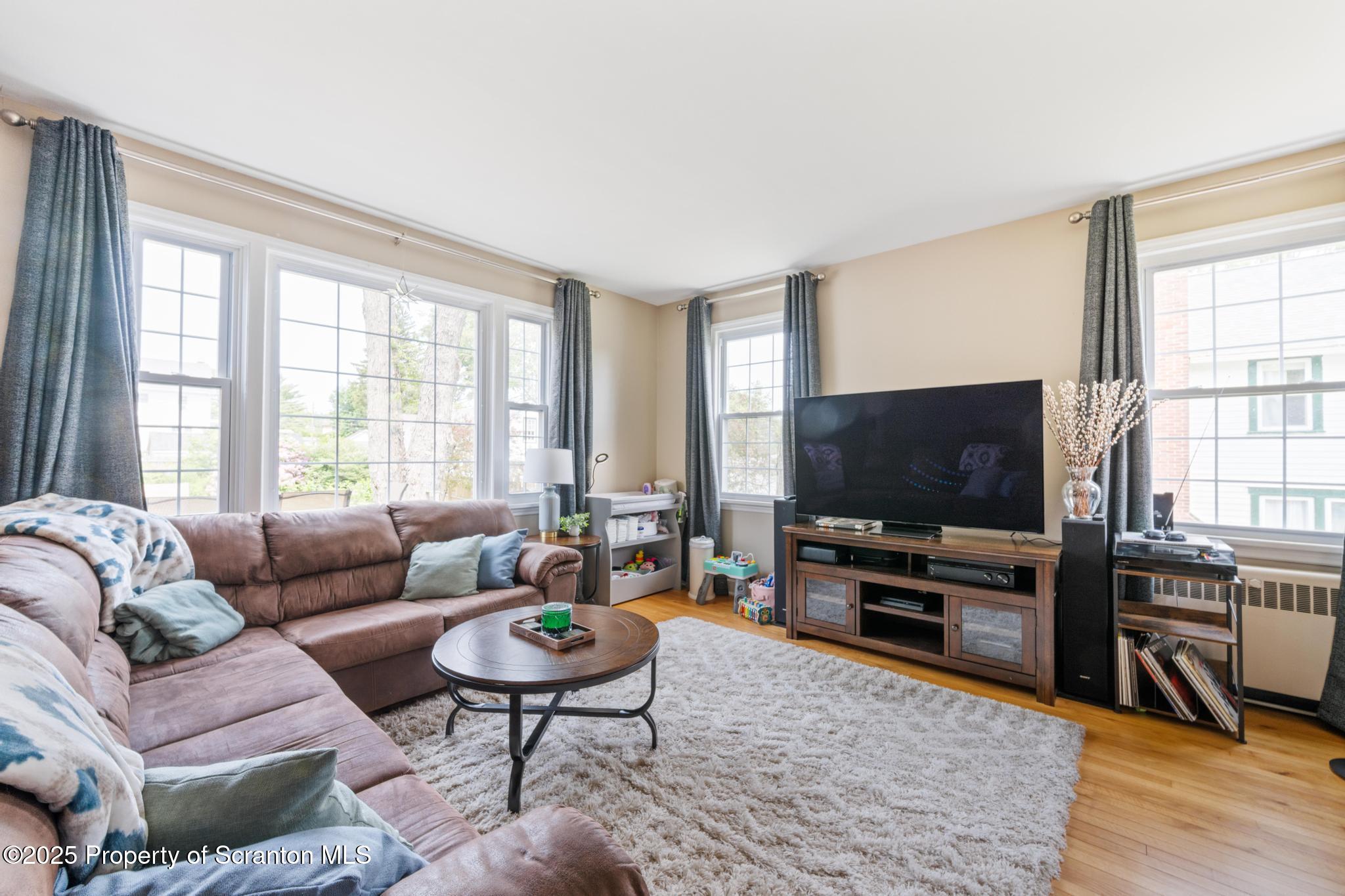 114 Spring Street Clarks Green, PA 18411 - Photo 5 of 47 a living room with furniture and a flat screen tv