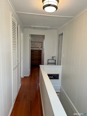 a bedroom with a bed and a mirror