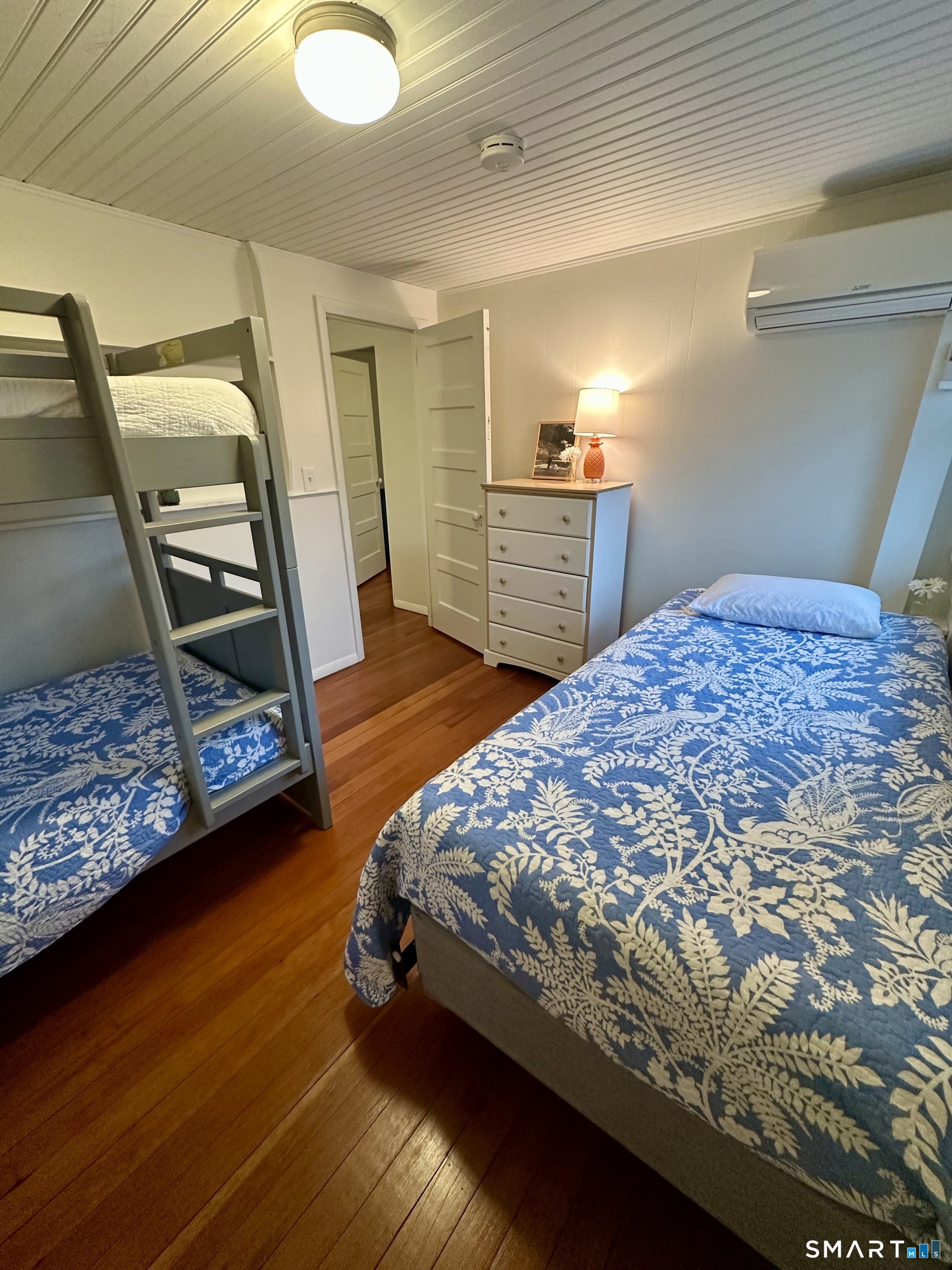 36 Attawan Road East Lyme, CT 06357 - Photo 27 of 40 a bedroom with a bed and a dresser