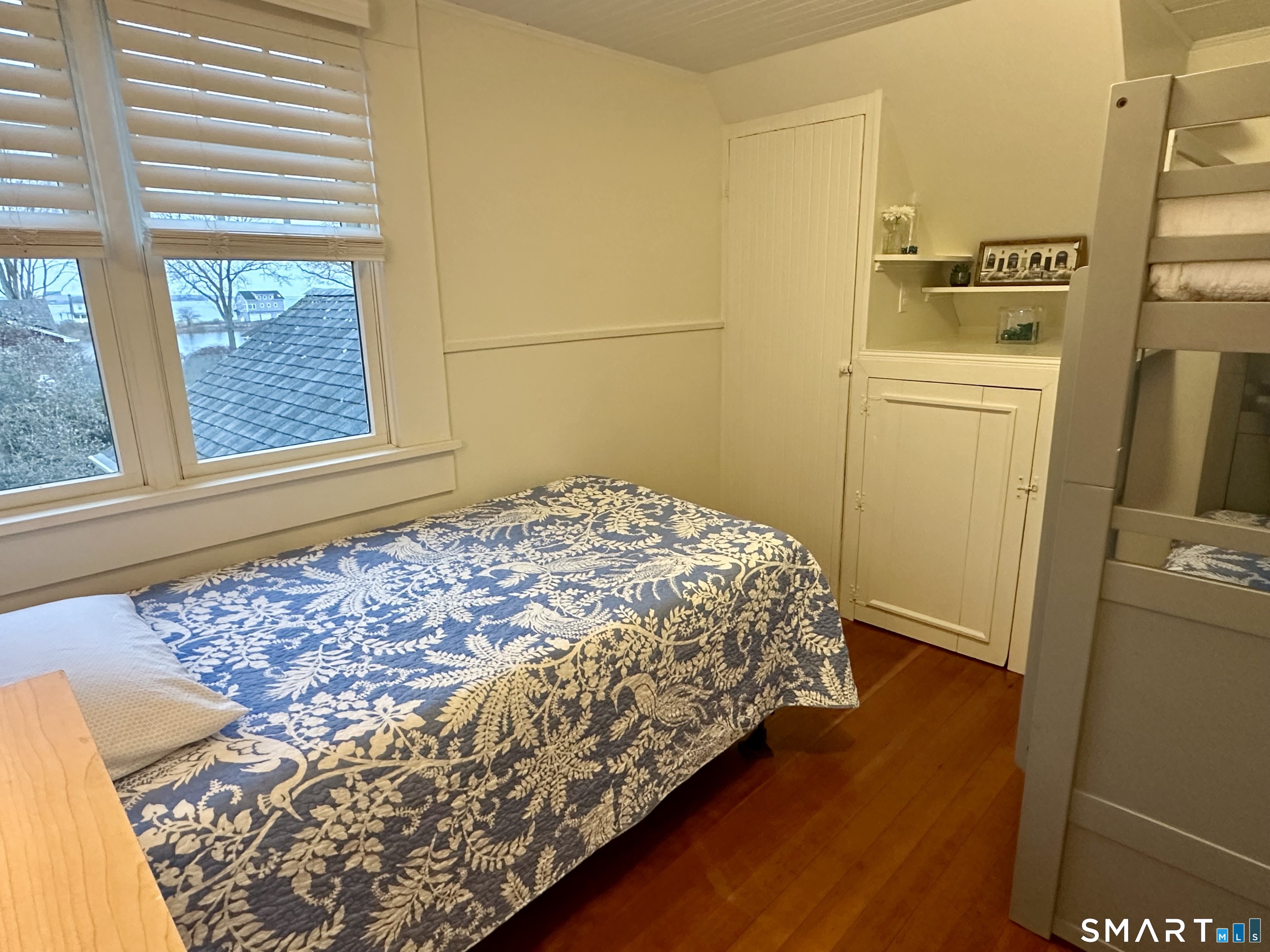 36 Attawan Road East Lyme, CT 06357 - Photo 28 of 40 a bedroom with a bed and wooden floor