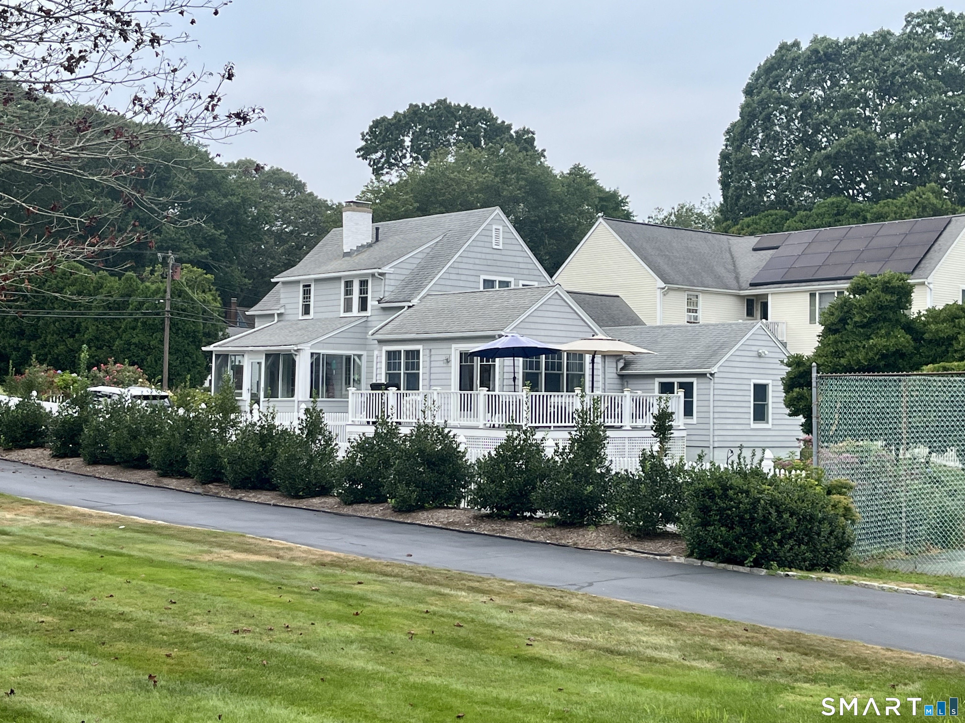 36 Attawan Road East Lyme, CT 06357 - Photo 3 of 40 View of Side and Back of House with wraparound deck.