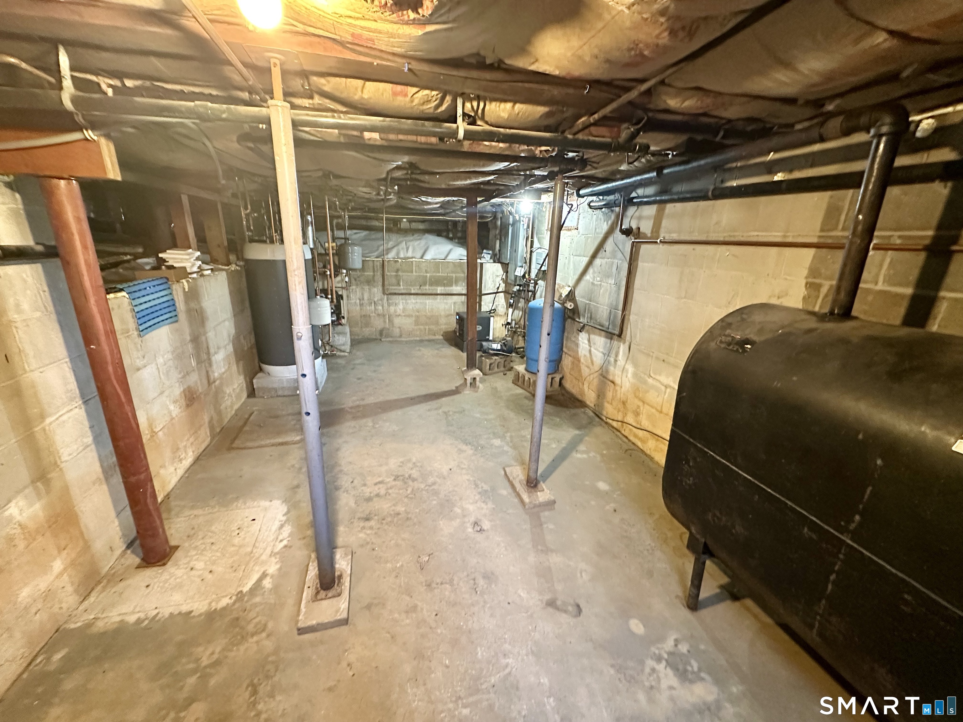 36 Attawan Road East Lyme, CT 06357 - Photo 34 of 40 Basement with Mechanicals: Electric Panel, Oil Tank, Dehumidifier, Thermostatic Hot Water Heater, Sump Pump. Sealed Liner throughout crawlspace areas.