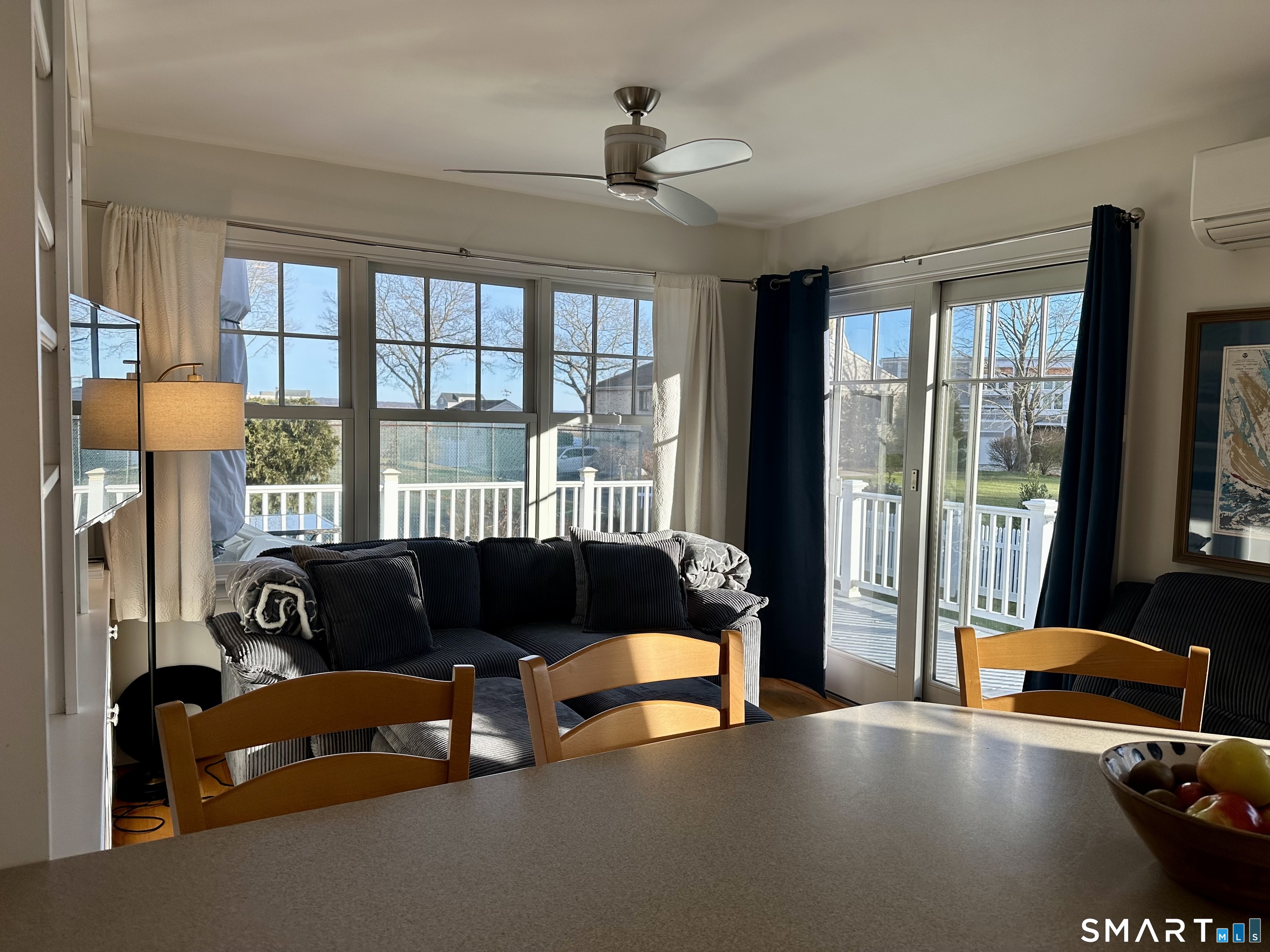 36 Attawan Road East Lyme, CT 06357 - Photo 8 of 40 Sitting Room off the Kitchen with lots of windows for Waterviews and Sunrise. Slider to wraparound Trex Deck.