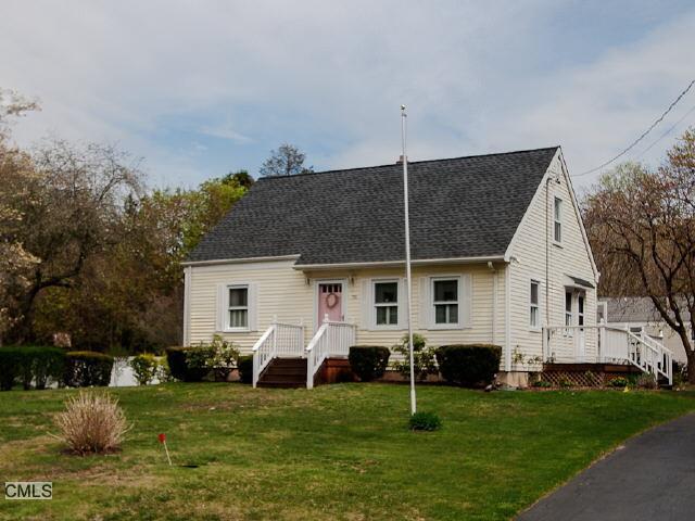 a view of a house with a backyard