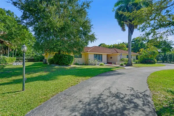 a front view of a house with yard