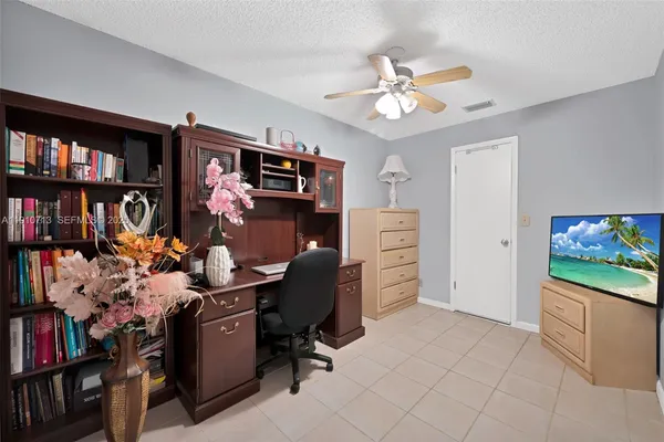 a view of a workspace with furniture