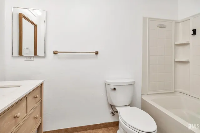a bathroom with a toilet a sink and bathtub