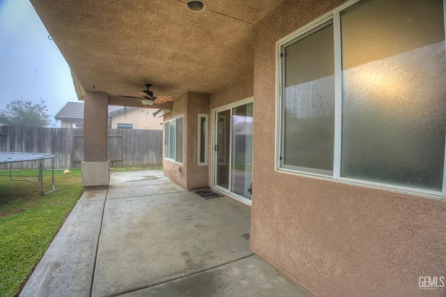 a view of a big room with glass door and balcony