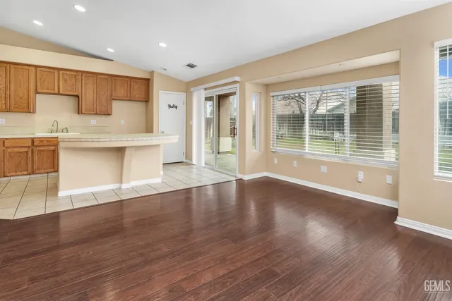 a view of a kitchen with a sink and a large window