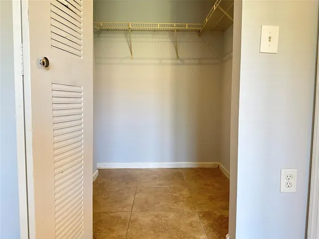 a view of a house with backyard and a garden