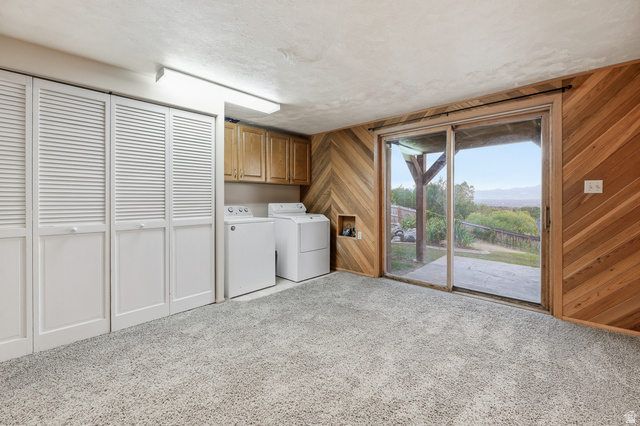 2342 Charros Road Sandy, UT 84092 - Photo 61 of 94 Spacious utility area featuring light wood cabinetry, a built-in laundry station, and three sets of louvered bifold doors
