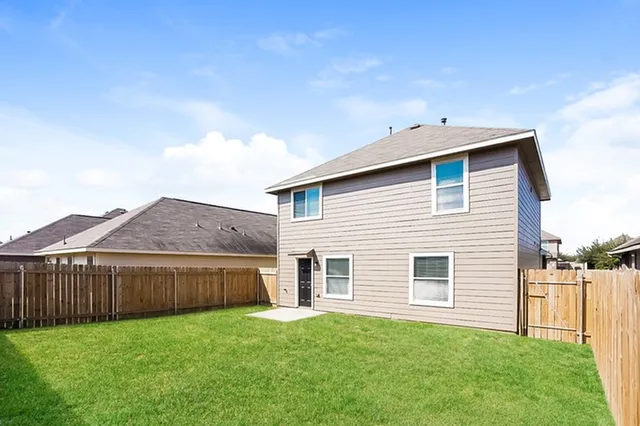 a front view of a house with yard