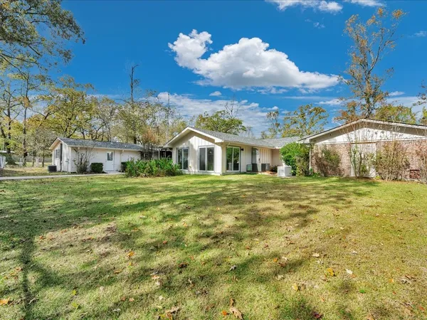a front view of house with garden