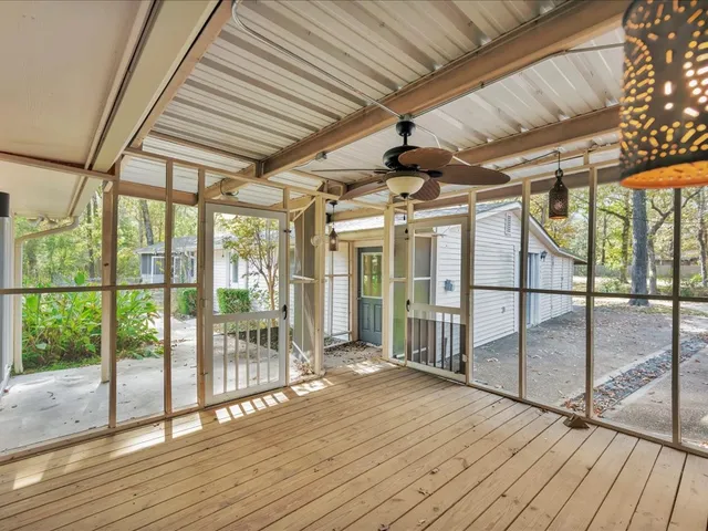 a view of porch with wooden floor
