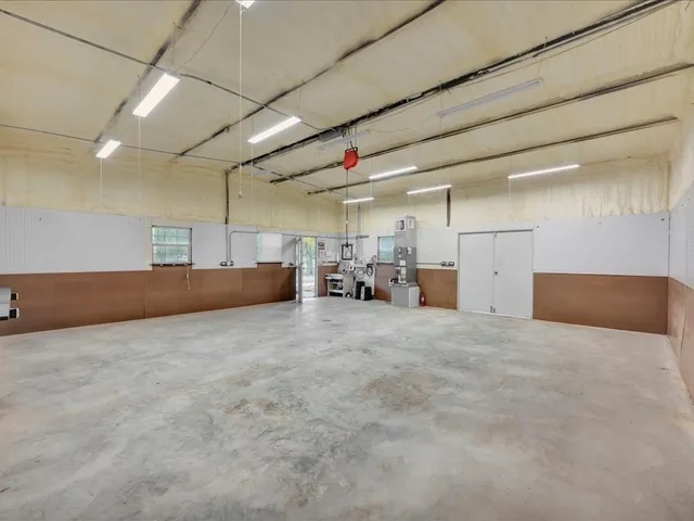 a large room with furniture and a window