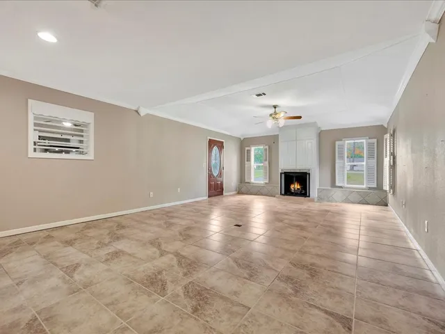 a view of an empty room with a fireplace