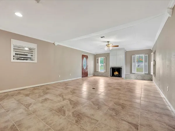 a view of an empty room with a fireplace