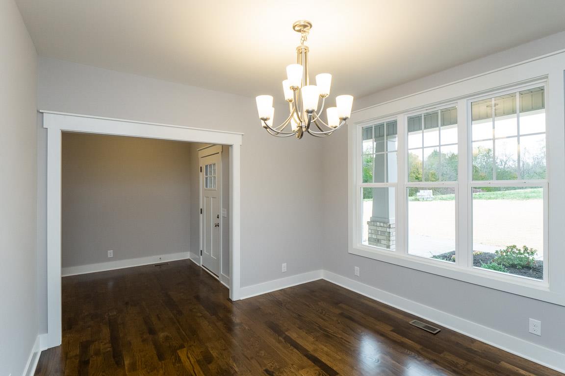 6617 Herbert Shannon Road Springfield, TN 37172 - Photo 8 of 30 a view of a room with wooden floor chandelier and windows