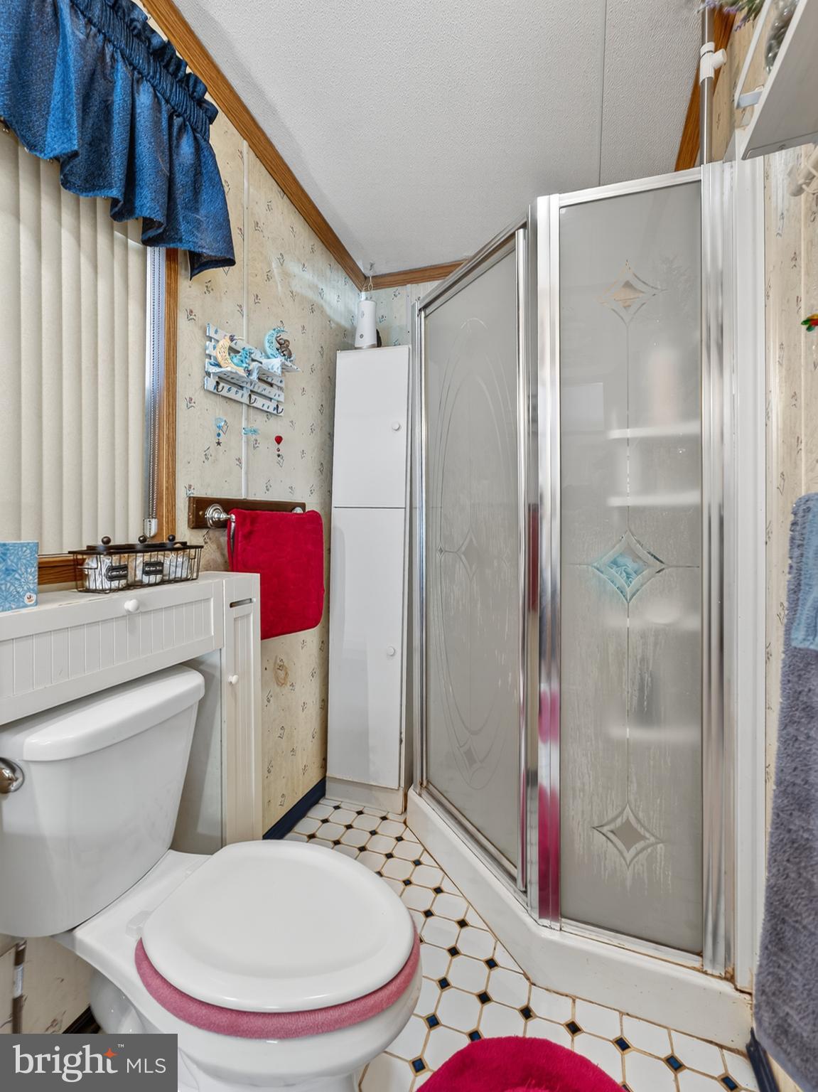 885 Cypress Ave Spring Spring City, PA 19475 - Photo 15 of 24 a white toilet sitting next to a bathroom sink and shower