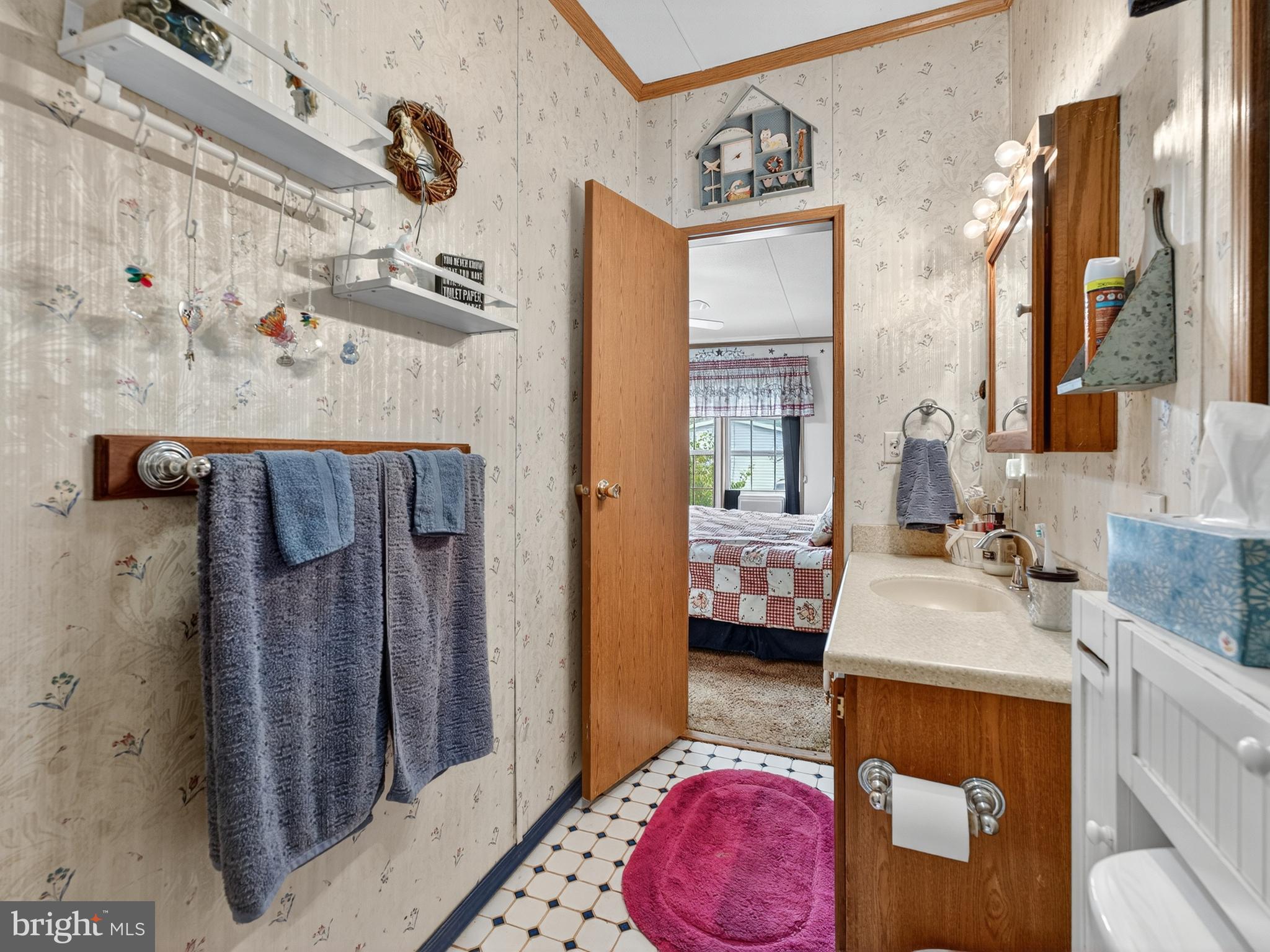 885 Cypress Ave Spring Spring City, PA 19475 - Photo 16 of 24 a en suite bathroom with a granite countertop sink a mirror and shower