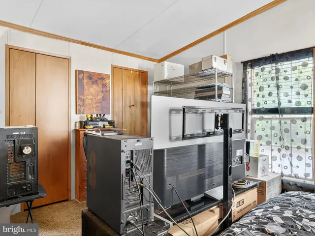 a kitchen with refrigerator and window