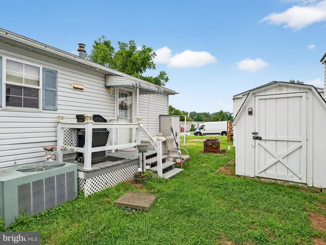 a view of a house with a back yard