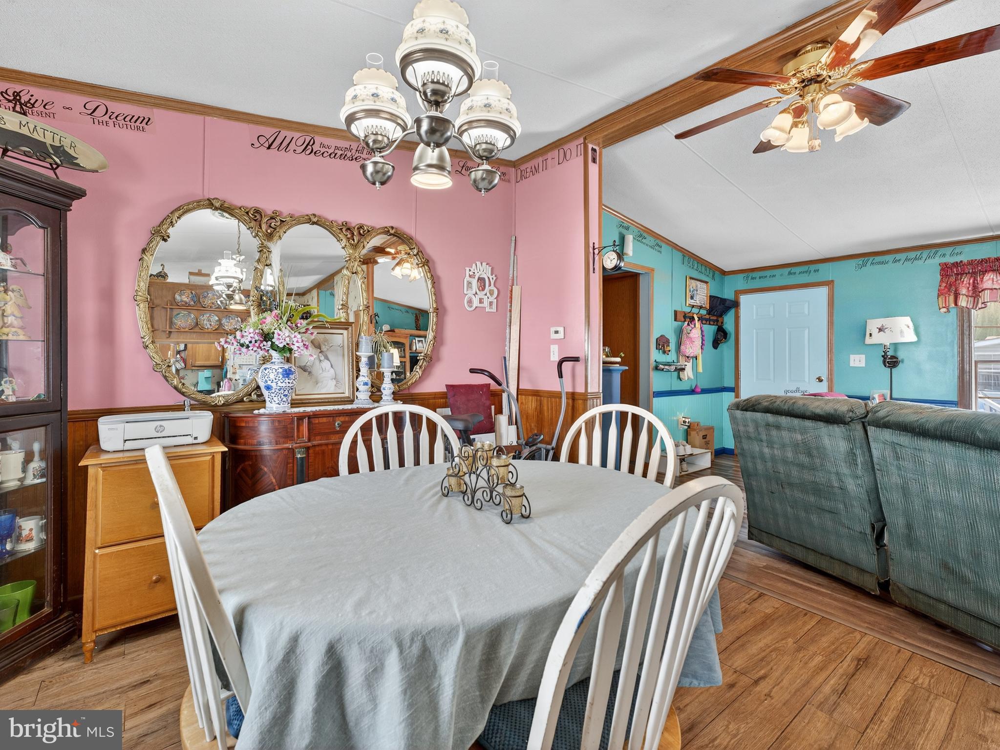 885 Cypress Ave Spring Spring City, PA 19475 - Photo 7 of 24 a view of a dining room with furniture a chandelier and wooden floor