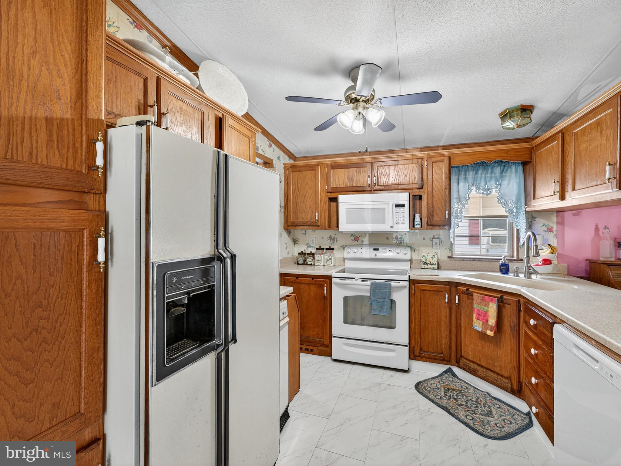 885 Cypress Ave Spring Spring City, PA 19475 - Photo 8 of 24 a kitchen with a sink cabinets stainless steel appliances and a window