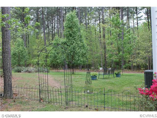 68 Rivers Bend Lane Bumpass, VA 23024 - Photo 24 of 24 Yard/Garden - Decorative metal fencing and arbor c