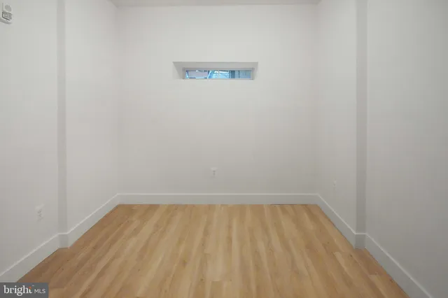 a view of room with wooden floor