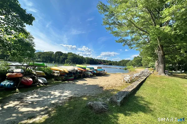 a view of a lake with cars parked