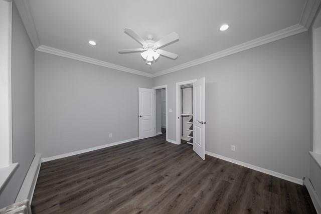 726 Howell Avenue, Unit J Riverhead, NY 11901 - Photo 6 of 8 an empty room with wooden floor and a ceiling fan