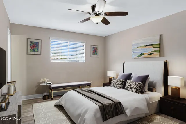 a bedroom with a bed and a chandelier