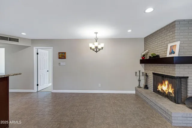 a view of an empty room with a fireplace