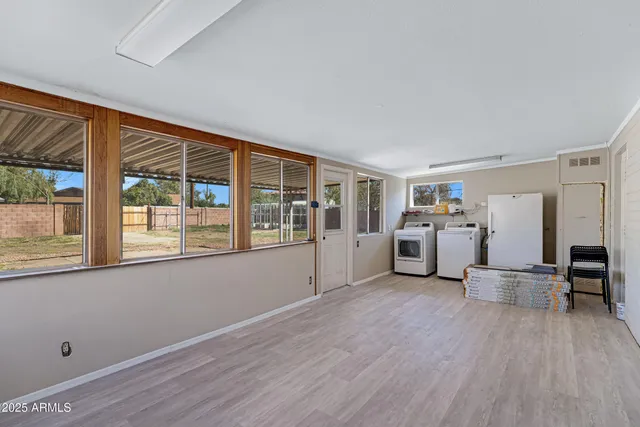 a room with furniture and white walls
