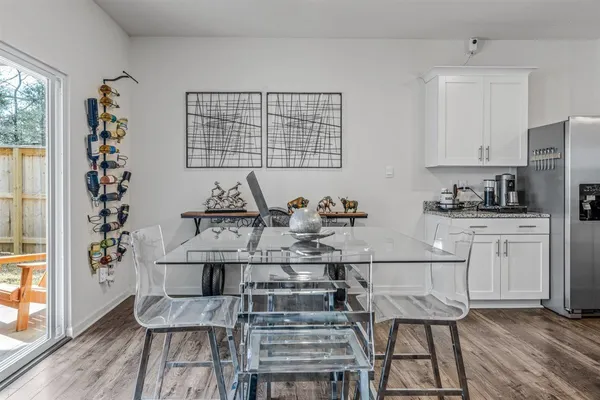 a kitchen with stainless steel appliances granite countertop a sink a stove and cabinets