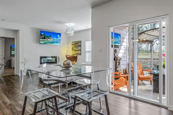 a kitchen with stainless steel appliances granite countertop a stove a microwave and a white cabinets