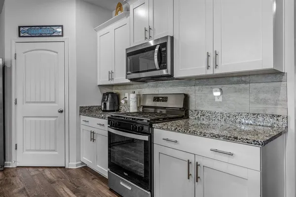 a bedroom with a bed and a table