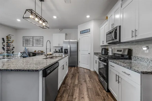 a bedroom with a bed and dresser