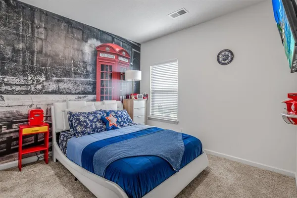 a view of a bedroom with washer and dryer