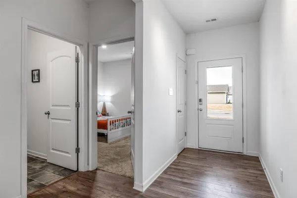 a bed room with a bed and a chair